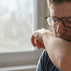 man coughing 