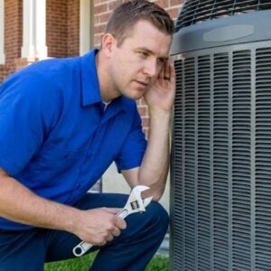 AC repairman listening to noises